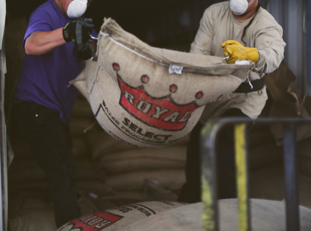 Specialty green coffee being unloaded at the Royal Coffee Warehouse